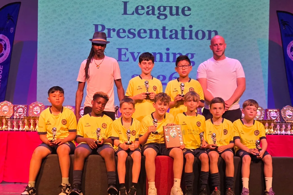 On stage with their trophies and the league shield at the league presentation evening