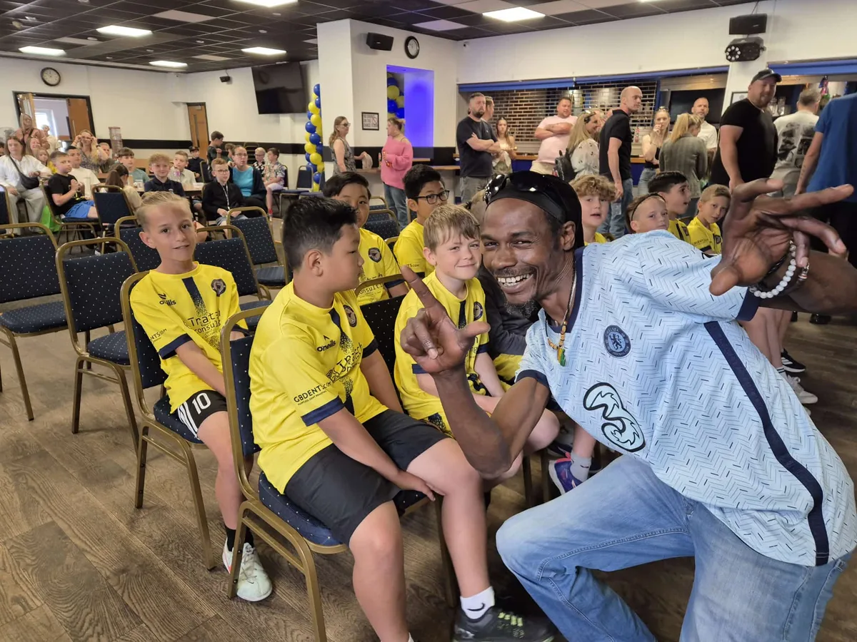 Players waiting in their seats in the clubhouse on presentation day