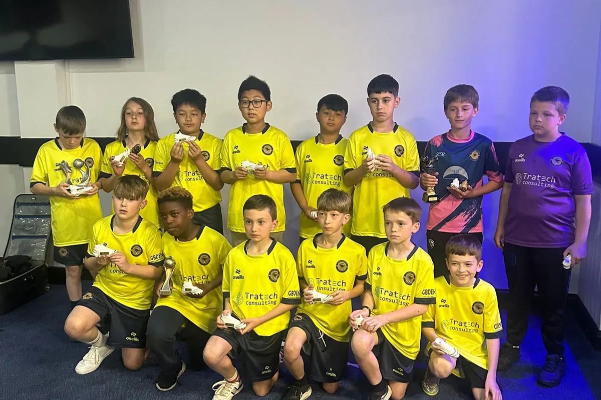 The squad together with their golden boot trophies at the presentation evening