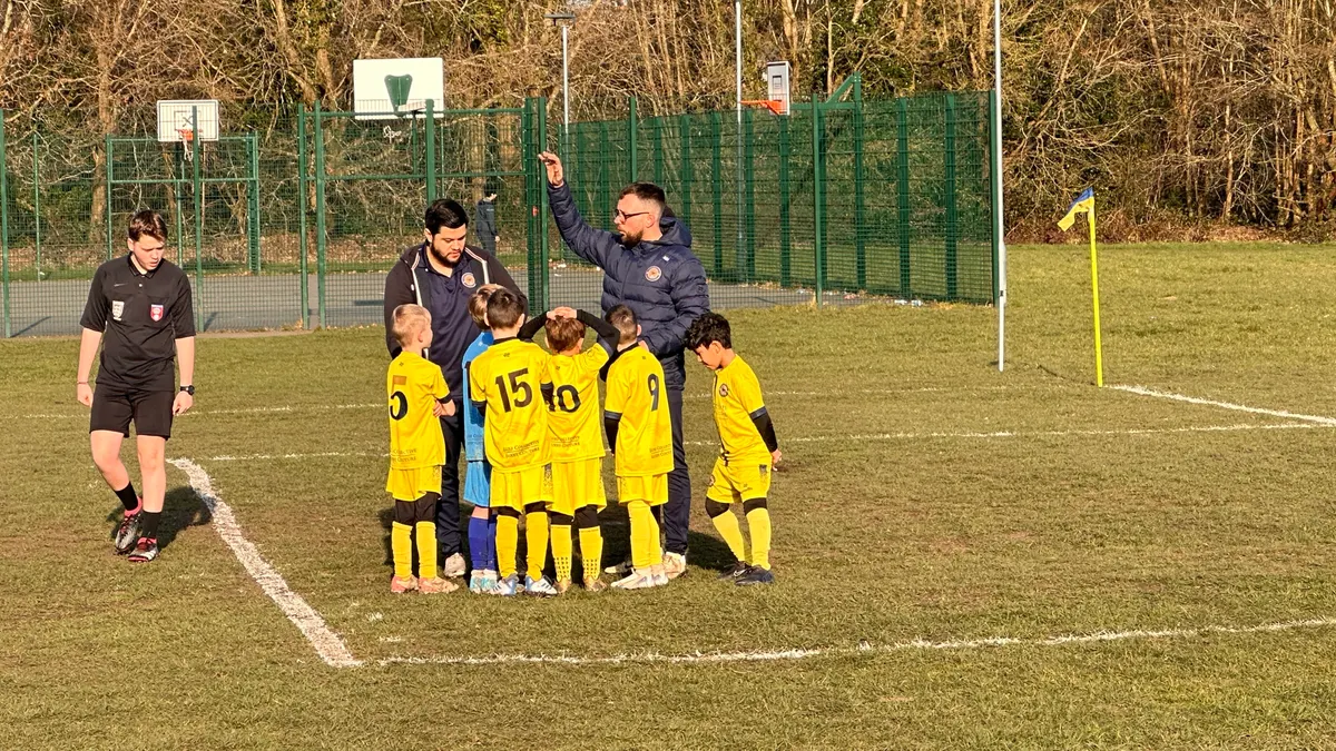 A team talk in the corner before kick-off