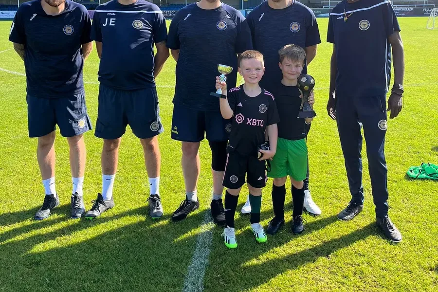 Trophy winners with the coaching team at Farnborough FC