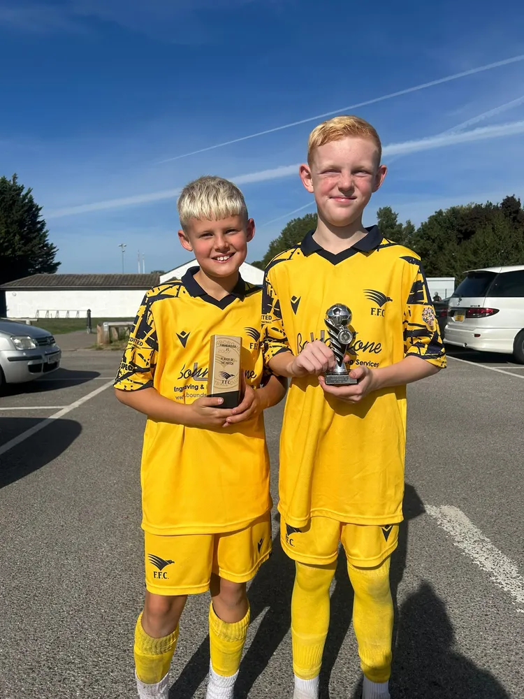 Two winners in the car park afterwards, with the Player of the Match and Supporters' Player of the Match trophies